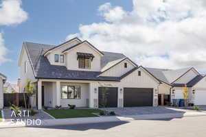 Modern inspired farmhouse with a garage