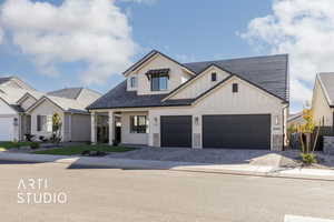 View of front facade featuring a garage