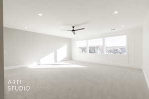 Spare room with light carpet and ceiling fan