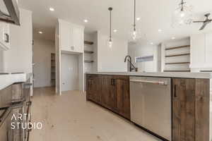 Kitchen with ceiling fan, light hardwood / wood-style flooring, dishwasher, white cabinetry, and hanging light fixtures