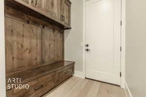 Mudroom with light wood-type flooring