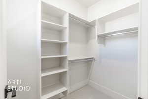 Spacious closet featuring carpet floors