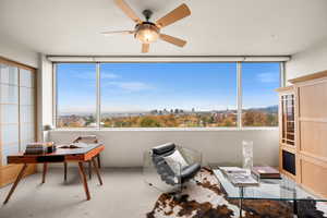 Interior space featuring carpet floors and ceiling fan