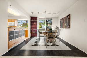 Dining area featuring track lighting