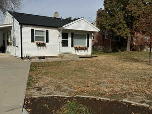 Bungalow-style house featuring a porch and a front yard