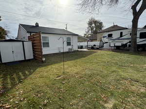 View of yard with a storage shed