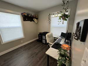 Office area featuring dark hardwood / wood-style flooring