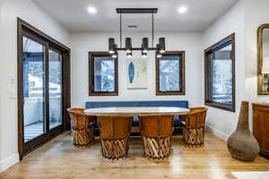 Interior space featuring pendant lighting, a notable chandelier, and light wood-type flooring