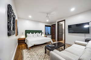 Bedroom with hardwood / wood-style flooring and ceiling fan