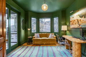 Living area with light wood-type flooring