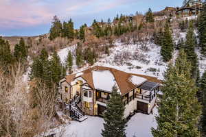 Snowy aerial view featuring a mountain view