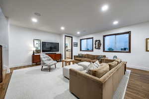 Living room with dark hardwood / wood-style floors