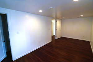 Basement featuring dark hardwood / wood-style floors