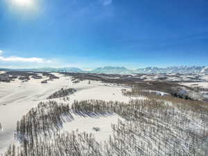 Snowy aerial view with a mountain view