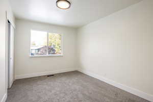 Empty room with carpet floors