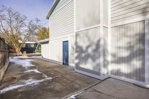 View of side of home with a patio