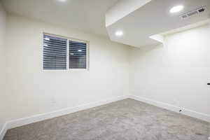 Empty room featuring carpet floors