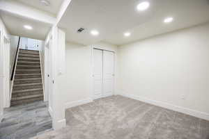 Basement featuring carpet