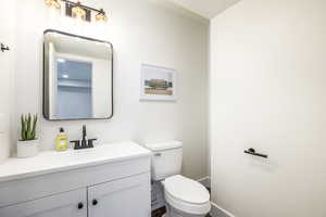 Bathroom featuring vanity and toilet