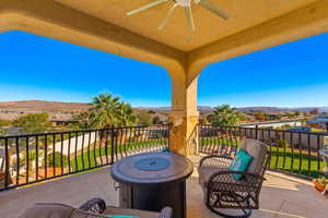 View of patio / terrace featuring ceiling fan, a balcony, and a mountain view