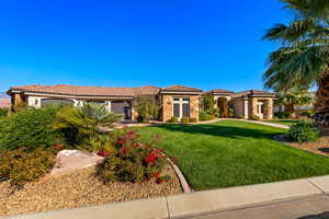 Mediterranean / spanish house featuring a front yard