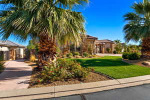 Mediterranean / spanish-style house with a front yard