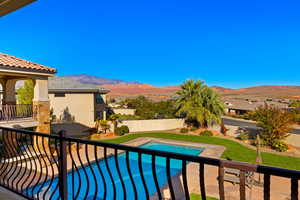 View of swimming pool featuring a mountain view and a patio