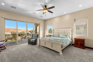 Carpeted bedroom with access to exterior, a mountain view, ceiling fan, and a textured ceiling