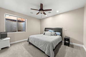 Bedroom with ceiling fan and carpet floors