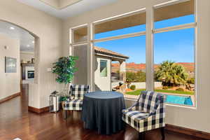 Sitting room featuring a mountain view, dark hardwood / wood-style flooring, and plenty of natural light