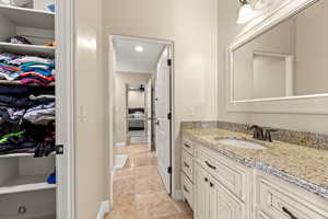 Bathroom with tile patterned flooring and vanity