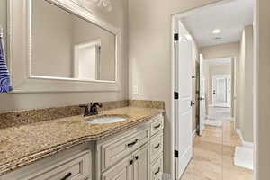 Bathroom with vanity and tile patterned floors