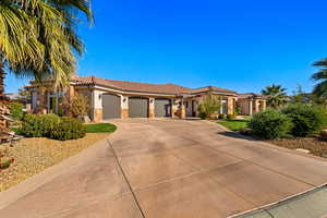 Mediterranean / spanish-style home with a garage