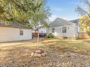 View of yard with an outdoor fire pit