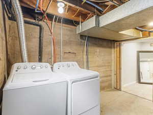 Laundry room featuring washer and clothes dryer