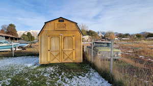 View of outbuilding featuring a mountain view