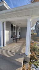 View of patio featuring covered porch