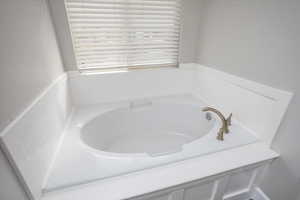 Bathroom with a tub to relax in