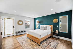 Bedroom featuring wood-type flooring