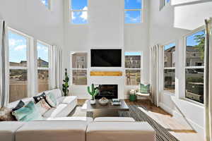 Sunroom featuring a brick fireplace