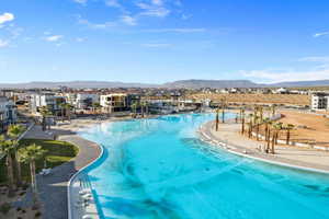 View of swimming pool with a mountain view