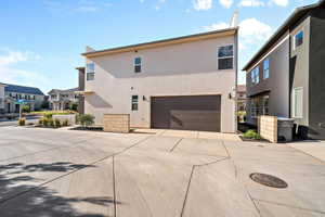 Rear view of property featuring a garage