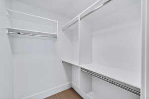 Spacious closet with carpet floors