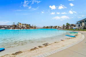 View of swimming pool featuring a beach view