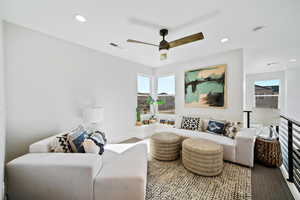 Living room featuring ceiling fan