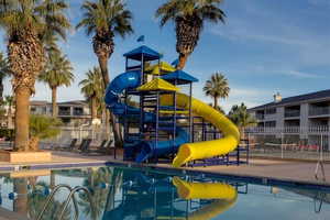 View of swimming pool featuring  a water slide