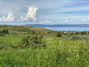 Property view of mountains featuring a water view