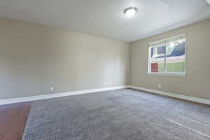 Empty room featuring hardwood / wood-style flooring