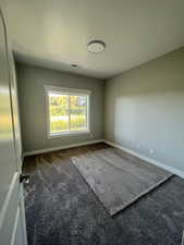 Example Unfurnished room with carpet floors