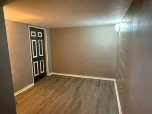 Unfurnished room featuring hardwood / wood-style floors